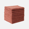 A stack of thick, terracotta-colored microfiber cleaning towels.