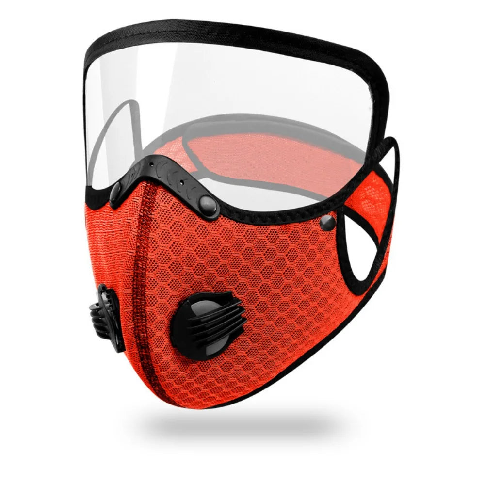 An orange cycling face mask with a clear shield and black accents.