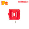 A red wall-mount battery holder with two metal pins is shown for Milwaukee power tool batteries.