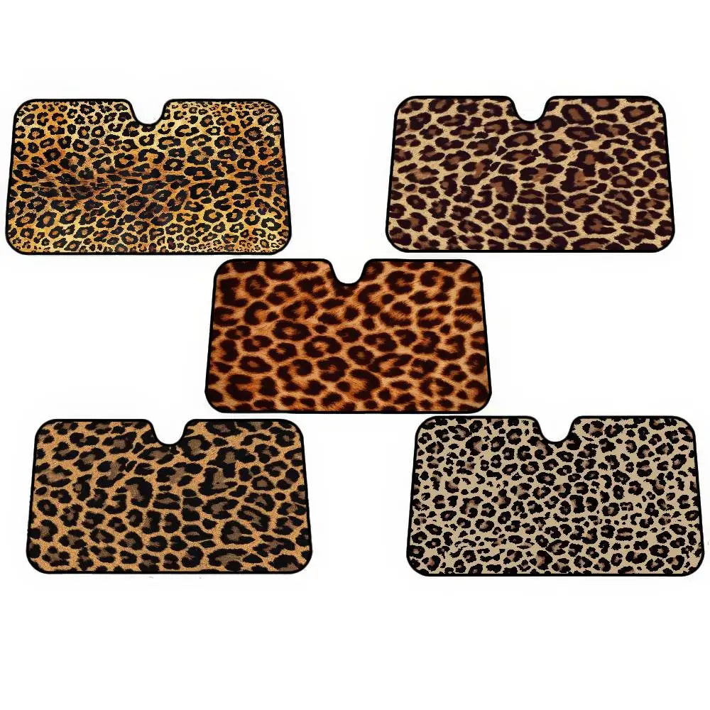Four rectangular leopard print car windshield sunshades in various sizes.