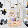 Rustic wooden baby shower crate with a rainbow design and stuffed animals for a baby theme