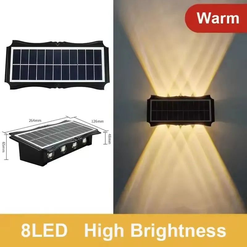 A solar powered LED wall light with a dark panel illuminating a bright, warm light beam.