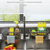 Stainless steel sink organizer with drainage tray holding cleaning tools and kitchen items