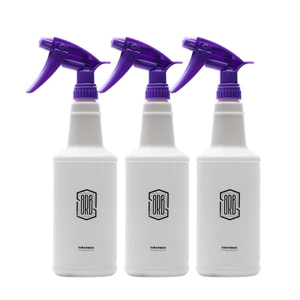 Three purple refillable spray bottles with flexible nozzles are shown against a white background.