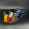 A replacement motorcycle helmet visor with iridescent, multi-colored lenses displayed against a dark background.
