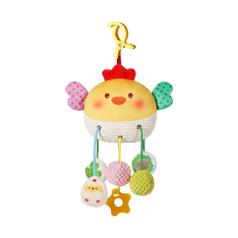 A yellow crab sensory toy with a rattle and teether hanging from a yellow hook.
