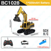 Yellow RC Car excavator with a black bucket and dump truck attachment shown next to its remote control and battery