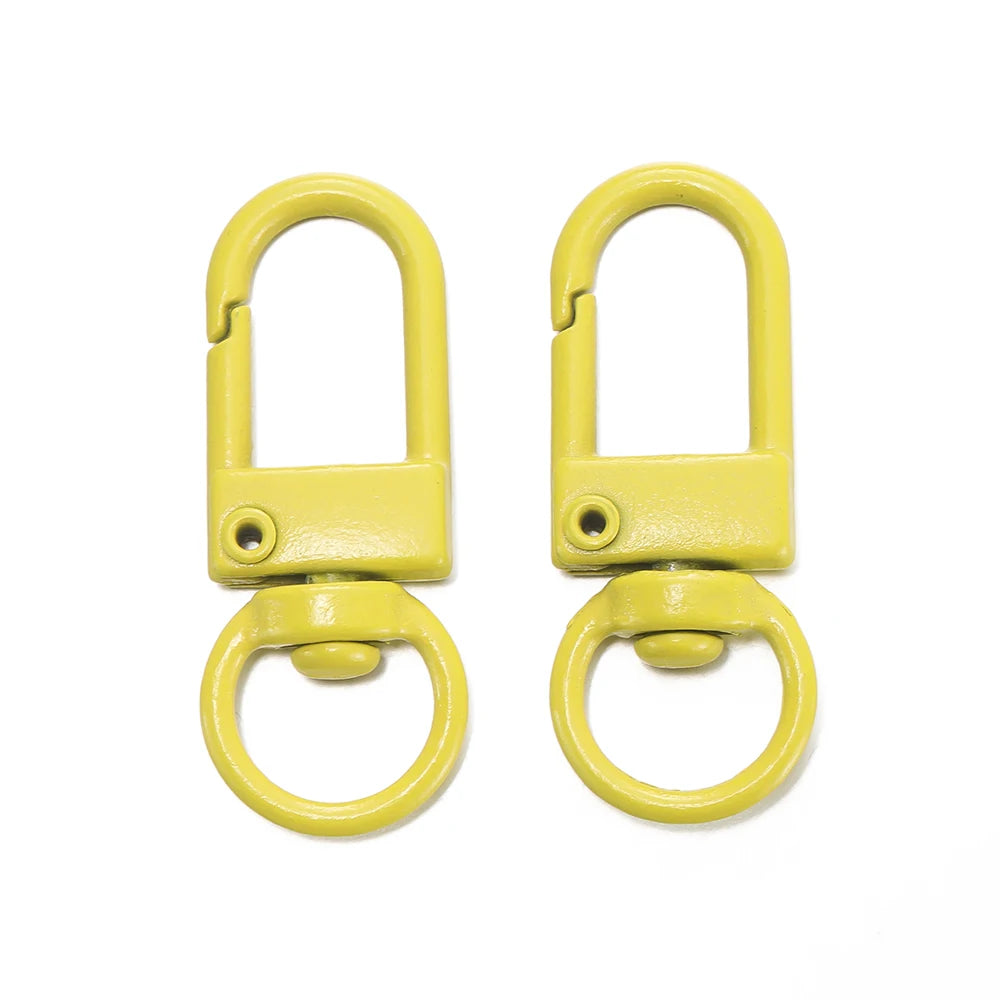 A pair of yellow alloy lobster clasp hooks for DIY jewelry making
