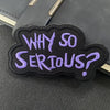 A black embroidered patch with purple text that reads Why So Serious?