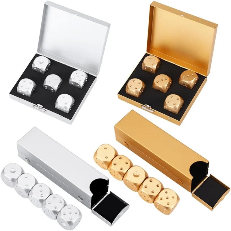 A set of five gold-colored metal dice with a storage box and an elongated rectangular box.