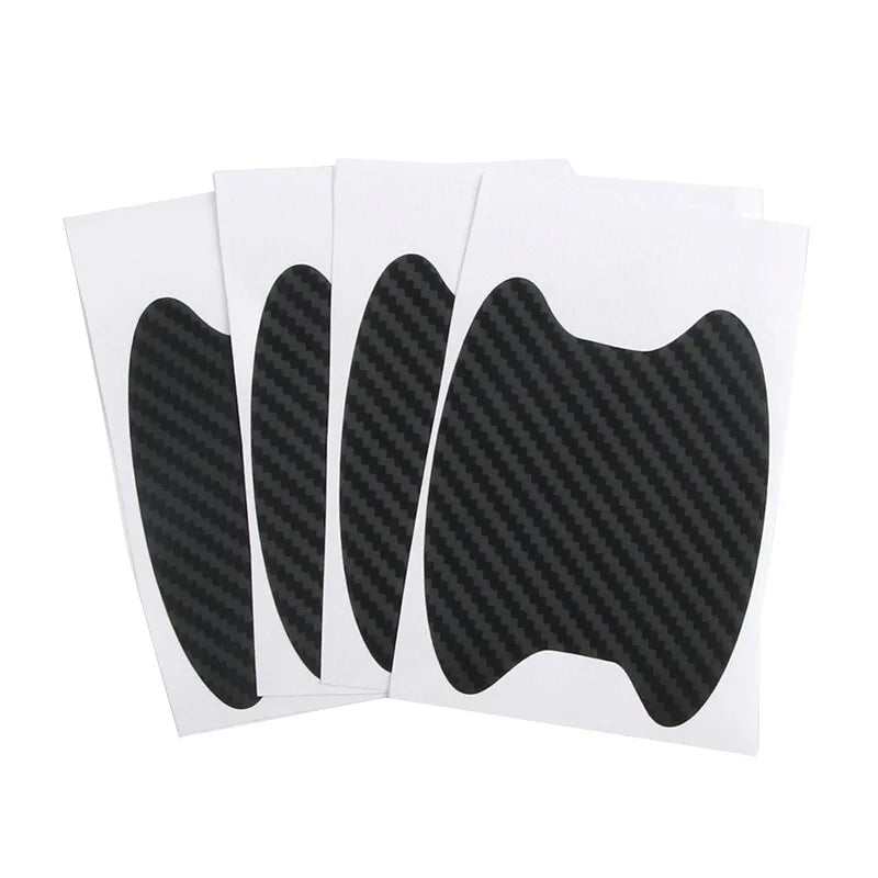 A pack of four black carbon fiber protective covers for car door handles.