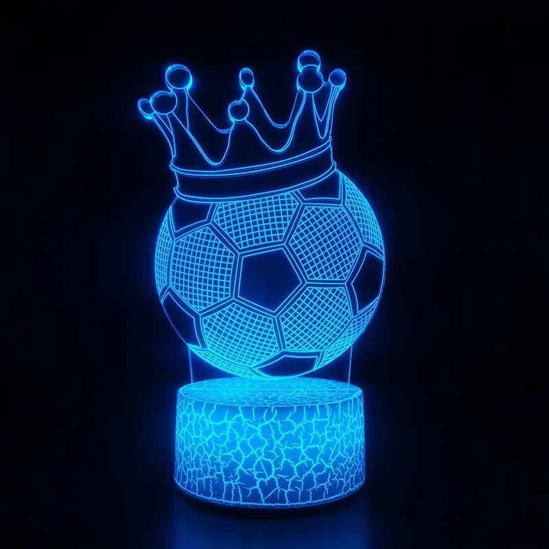 A glowing blue wireframe soccer ball crown sculpture on a stand.