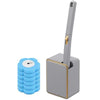 A wall-mounted disposable toilet brush set with a gray handle and blue bristles.