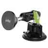 A black magnetic car phone mount with a green lever and a flat adhesive base.