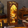 A wooden book nook kit with LED lighting displayed in a box, featuring an intricate miniature scene.