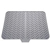 Gray silicone dish drying mat with a built-in drain lip for drying dishes.