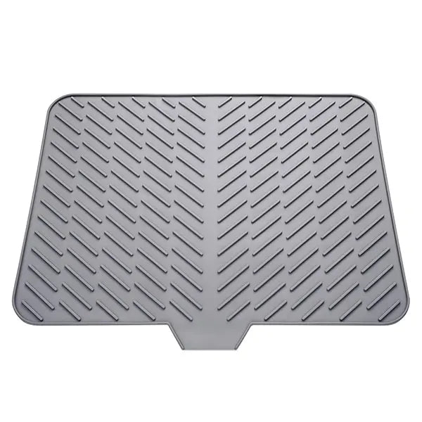 Gray silicone dish drying mat with a built-in drain lip for drying dishes.