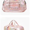 A pink iridescent travel duffel bag with a padded handle and zipper closure.