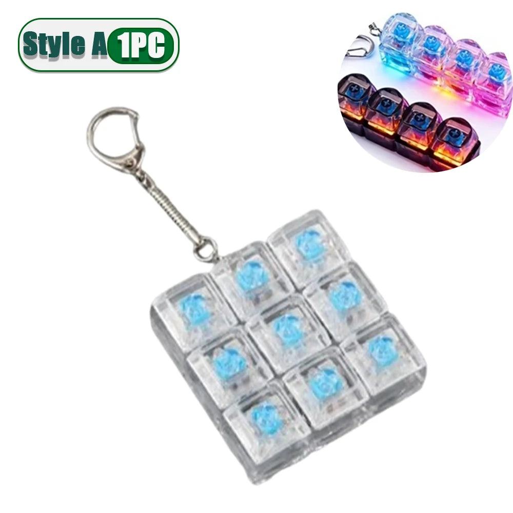 A clear square fidget keychain with multiple blue LED lights and a silver hook.
