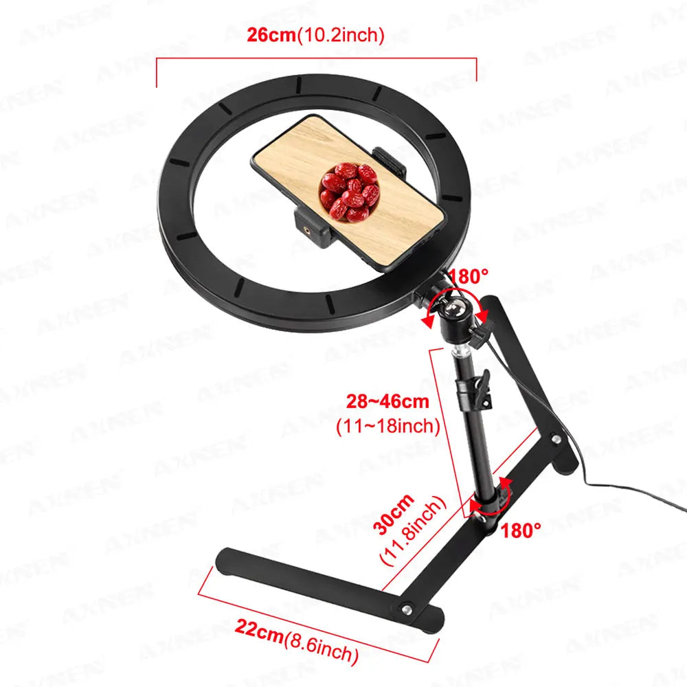 Black foldable overhead tripod with a ring light setup for smartphone photography