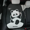 Black and white panda themed car seat cover set with headrest pillows on a vehicle seat.