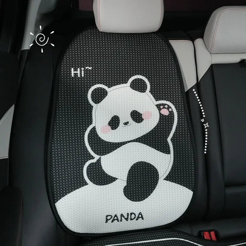 Black and white panda themed car seat cover set with headrest pillows on a vehicle seat.