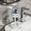 Modern bathroom toothbrush holder with a glass dust cover and drainage system mounted on a white sink.