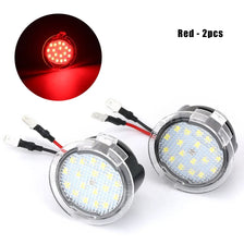 Two red LED puddle lights for vehicles, showing the light source and complete units.