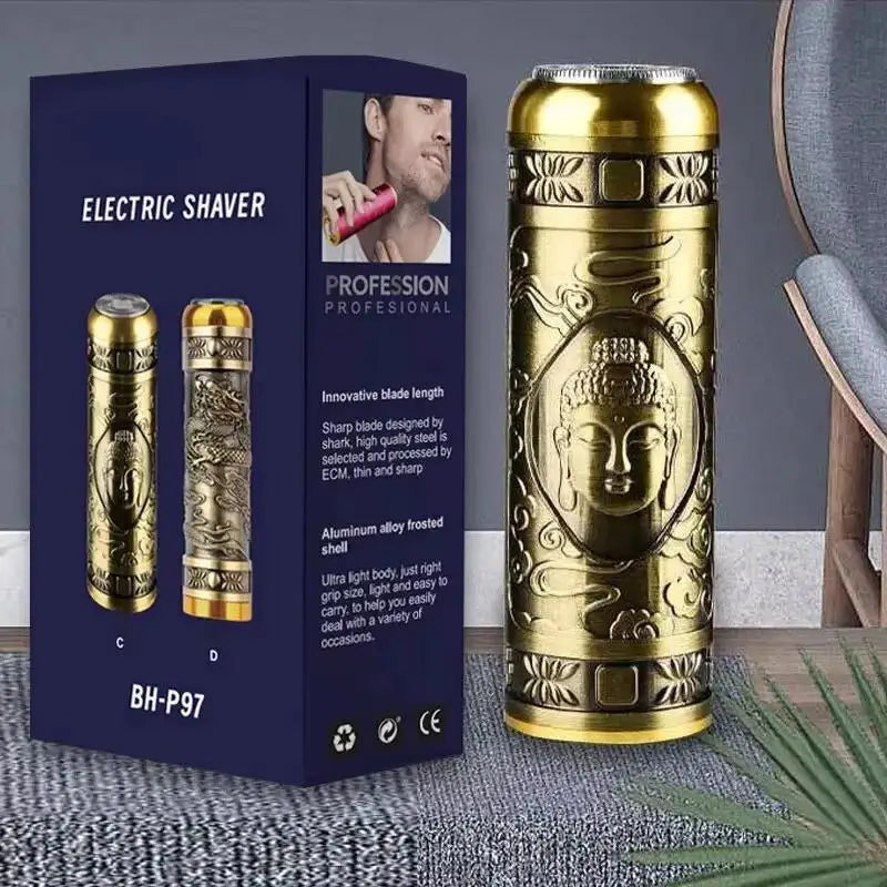A gold electric shaver is displayed next to its packaging box on a gray surface.
