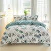 A white duvet cover set with teal and grey watercolor floral print displayed on a bed.