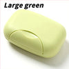 A large green portable soap holder with a lid shown in a close-up view.