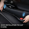 Hands are installing a car seat gap filler organizer into the interior of a car seat.