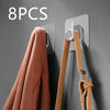 Eight pieces of extra-large strong adhesive hooks mounted on a gray wall, shown next to a coat hanger.