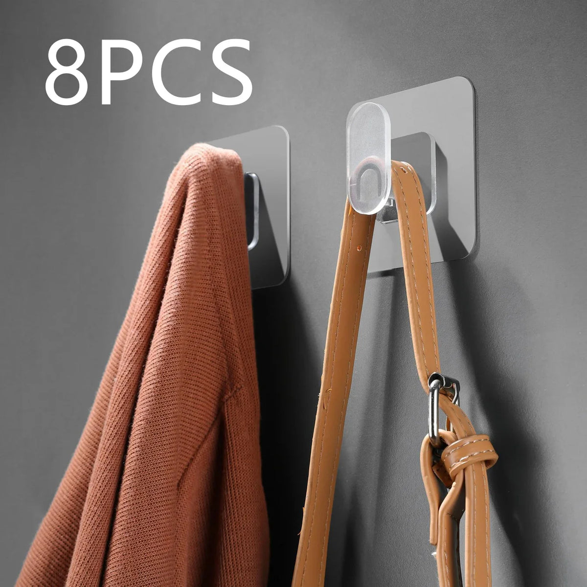 Eight pieces of extra-large strong adhesive hooks mounted on a gray wall, shown next to a coat hanger.