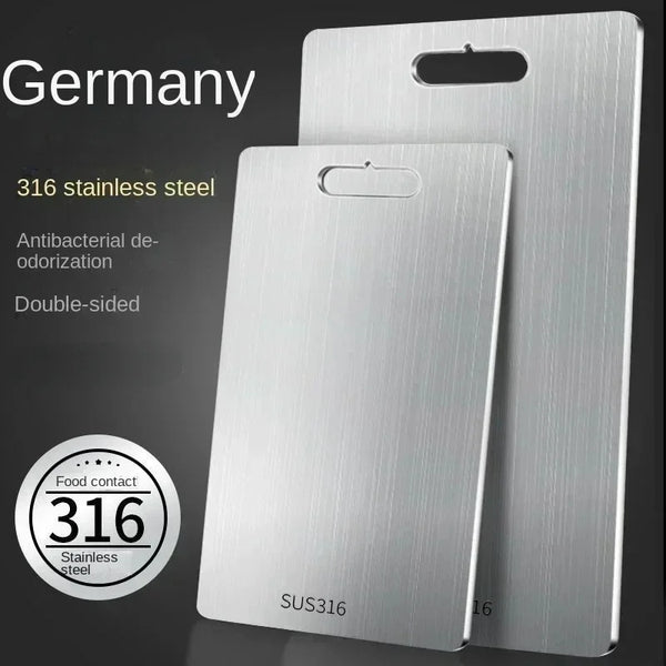 A silver 316 stainless steel cutting board with a dual-sided design shown against a dark background.