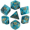 A collection of seven polyhedral dice in various shades of teal and blue.