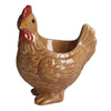 A ceramic chicken egg cup with a reddish comb and yellow beak.