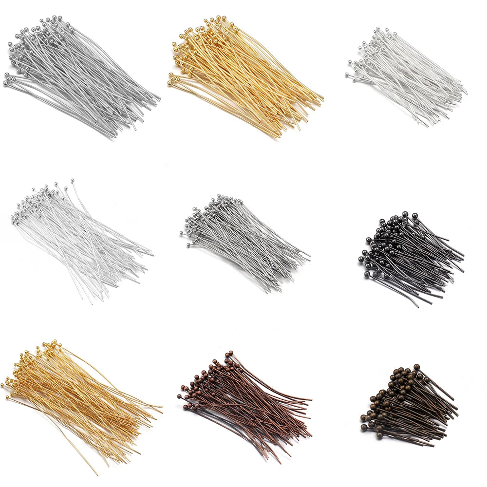 Various strands of gold-plated brass ball head pins for jewelry making shown in different finishes and angles