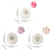 A set of silicone molds shaped like pink roses for crafting candles, soap, and resin