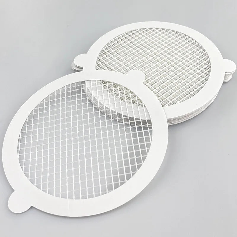Two white mesh filters used as disposable shower drain hair catchers or sink/floor drain mesh filters
