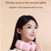 A woman is wearing a pink U-shaped neck wrap for support and hot compress.