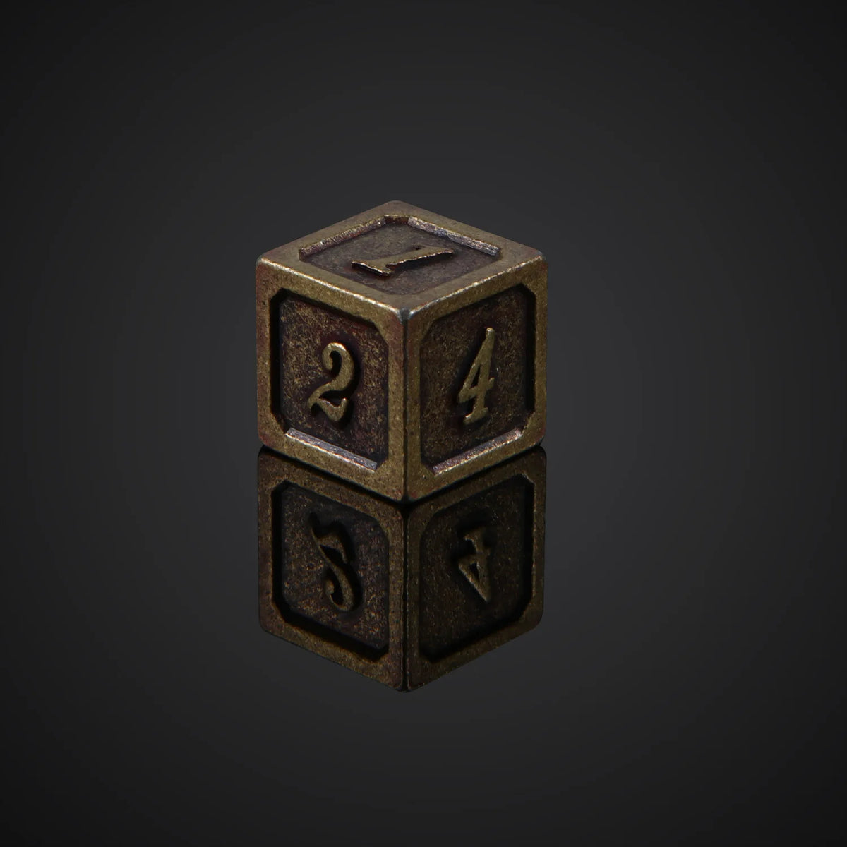 A bronze metal polyhedral dice set, featuring a d20 and a d4, resting on a reflective surface.