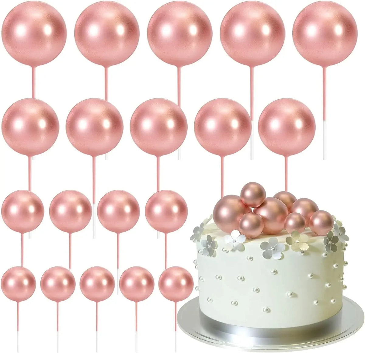 Ein Set aus 20 rosa und goldenen Kugle-Konditordekorationen auf Stäbchen