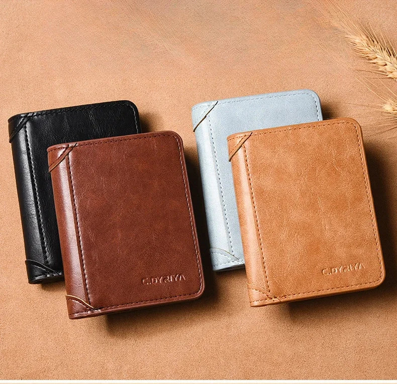 Three slim PU leather card holder wallets in black, light blue, and tan resting on a brown surface.