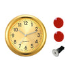A round gold-colored quartz clock face with luminous hands and a black mounting pin.