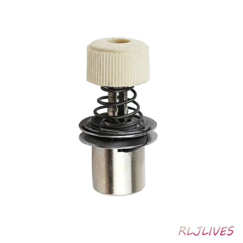 A silver thread tension gripper with a black spring and a white plastic collar.