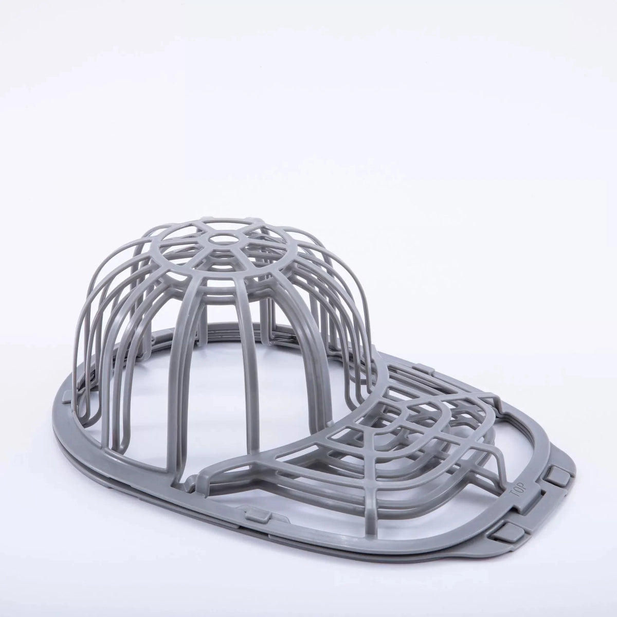 A gray cap protector cage designed to fit a washing machine drum.