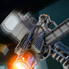 A close-up of a Z-Lock water gun firing, showing a bright orange muzzle flash and intense stream of water.