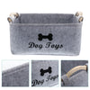 Gray felt pet toy storage basket with wooden handles