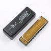 A black case and a gold harmonica are shown, featuring the Swan Harmonica brand logo.